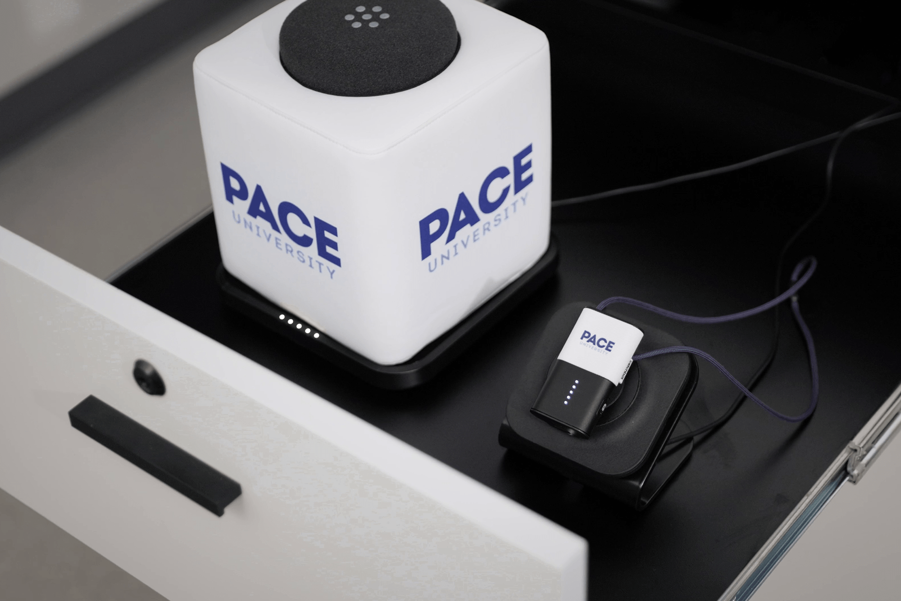 Customized Pace University Plus system with Cube and Clip microphones placed in a tech drawer.