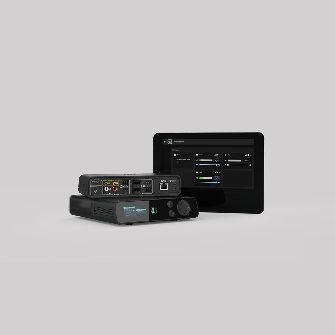 A front and back image of the Catchbox Plus Hub DSP receiver, featuring the graphical user interface (UI) on the front, and 3-pin, RCA, USB-C, aux, and network connections on the back. Next to it, a tablet displays access to the Catchbox Control and Monitoring Center.