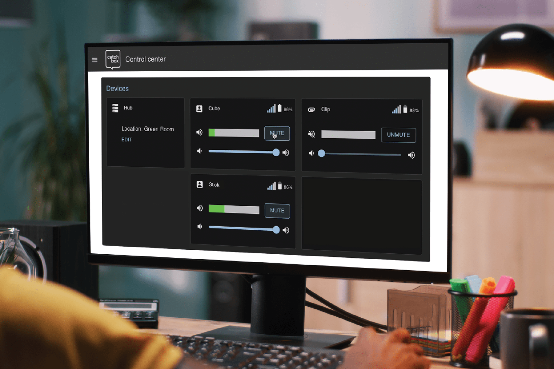A monitor screen displaying the controls of the Catchbox Control and Monitoring Center, showcasing various settings and management tools for overseeing microphone systems.