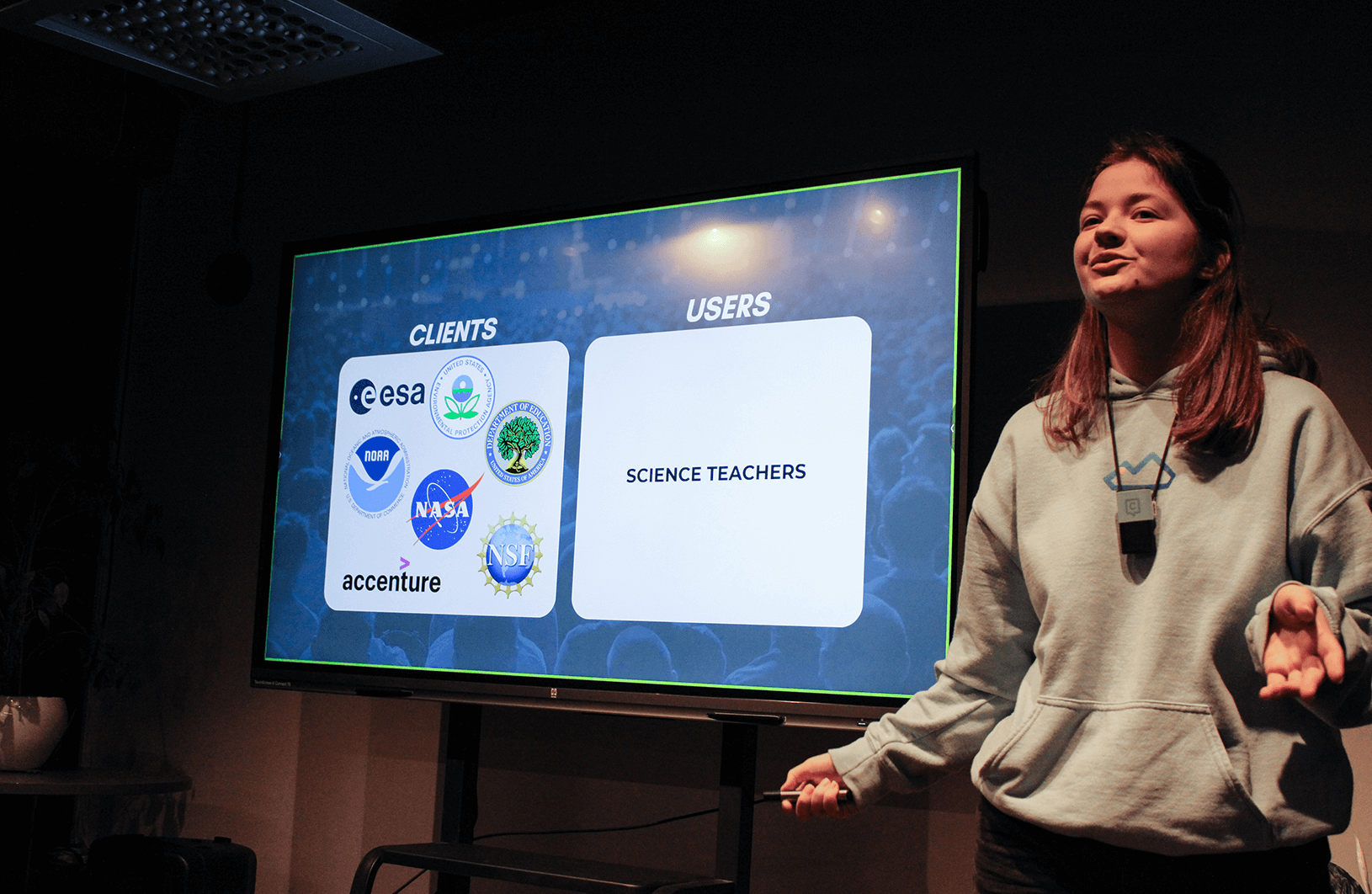 For accessibility in higher education student is presenting and using Catchbox lavalier mic.